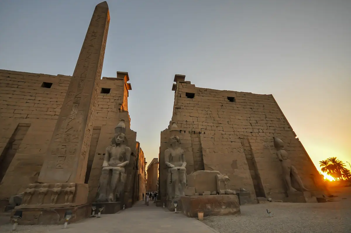 Luxor Temple pylon and obelisk seen from close up in warm evening light
